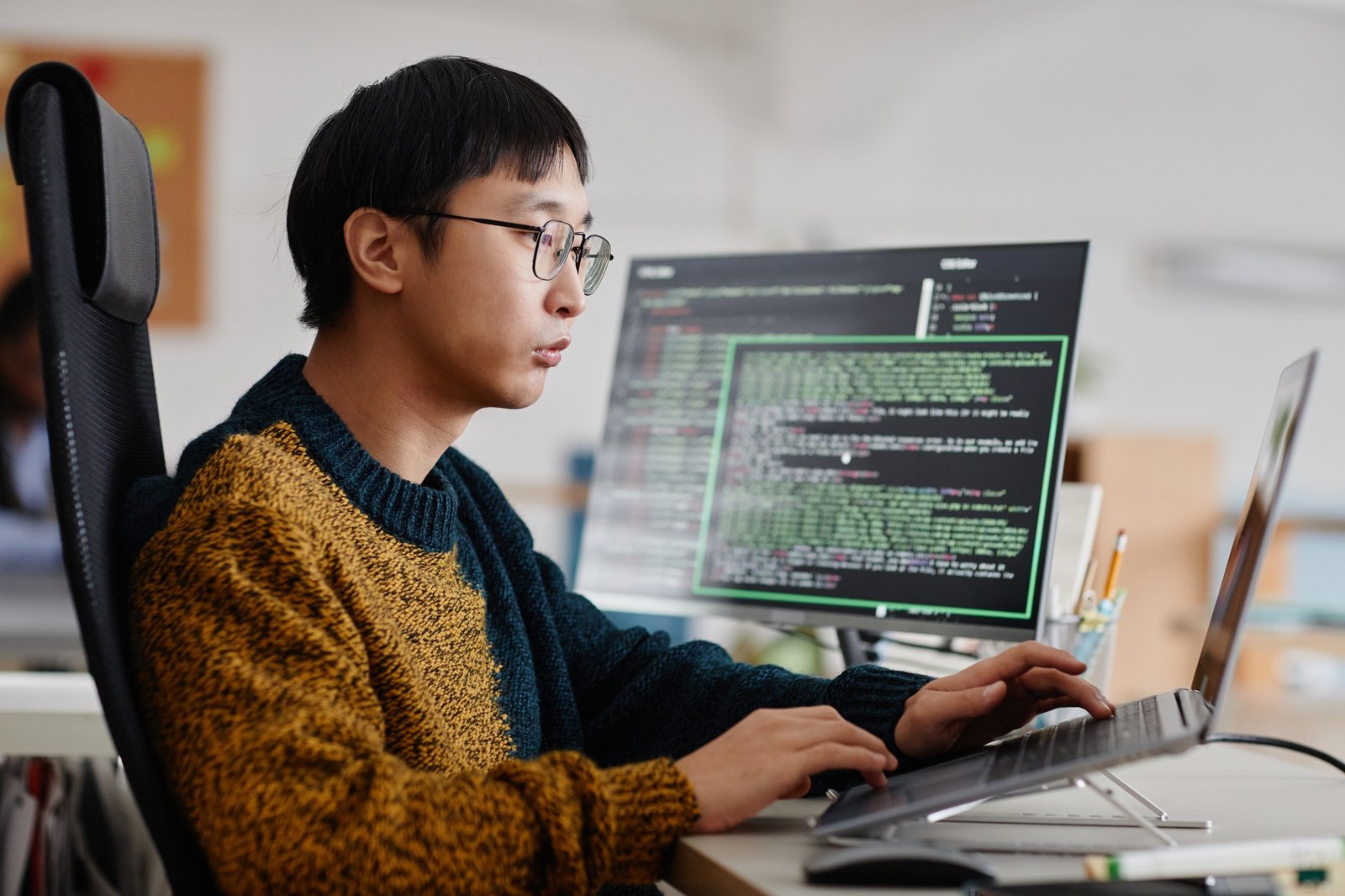 Focused Software Developer Working on Coding Projects